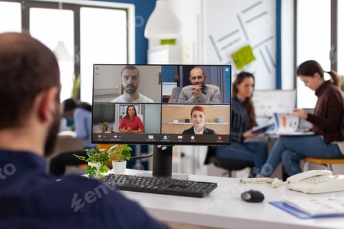 Preview: Businessman explaining company strategy to remote business team during online videocall