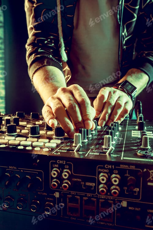 Preview: DJ playing music at mixer closeup