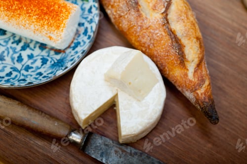 Preview: Assorted Cheeses and Bread on Wooden Cutting Board