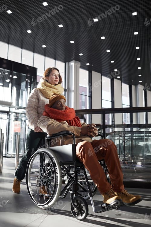 Preview: Interabled Couple Entering Shopping Mall