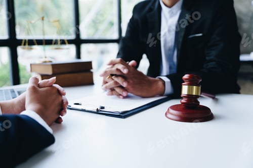 Preview: Consultation of Businesswoman and Male lawyer or judge counselor having team meeting with clien