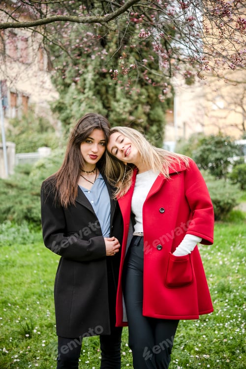 Preview: Friends sharing a cozy moment in a blossoming spring garden.