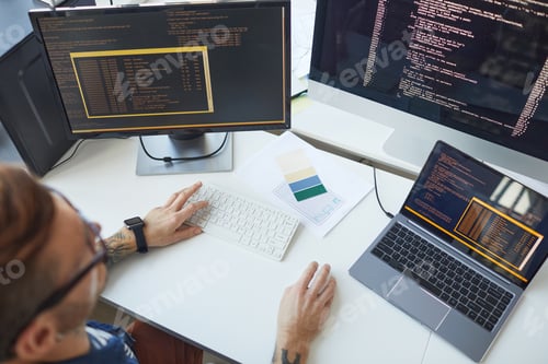 Preview: IT Programmer Using Computers with Code on Screen