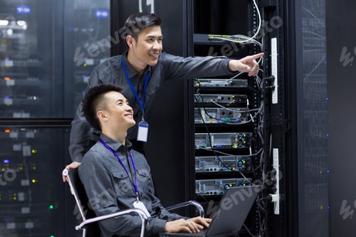 Preview: Technicians doing maintenance in computer room