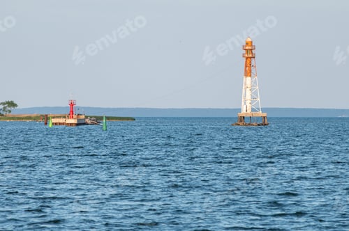 Preview: Jetty with towers and buoys. Beautiful seascape, copy space