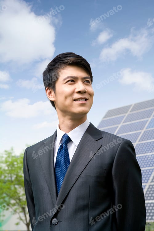 Preview: Portrait of a Chinese businessman in front of solar panels