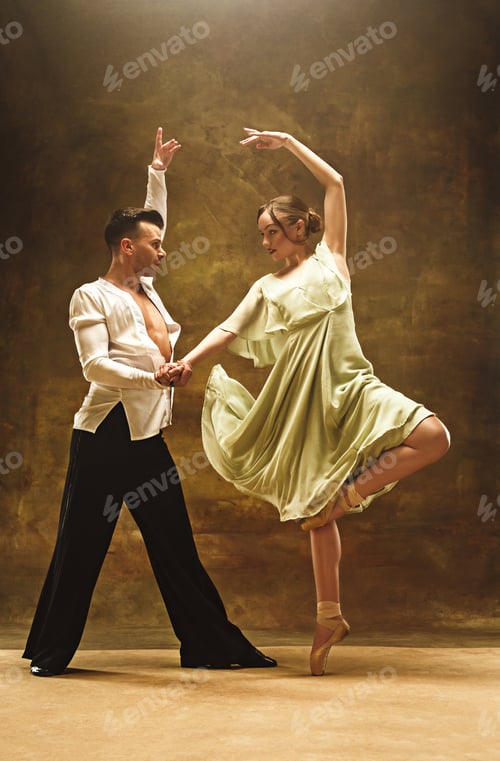 Preview: Flexible young modern dance couple posing in studio.