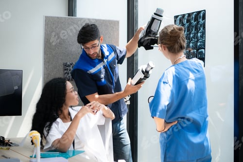 Preview: Engineers, doctors and physical therapists brainstorm ideas to design a robot with arm and hand