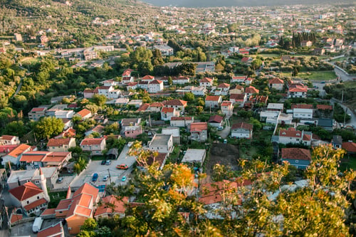 Preview: Mosque and panoramic cityscape of town Bar in Montenegro with road and houses, aerial view