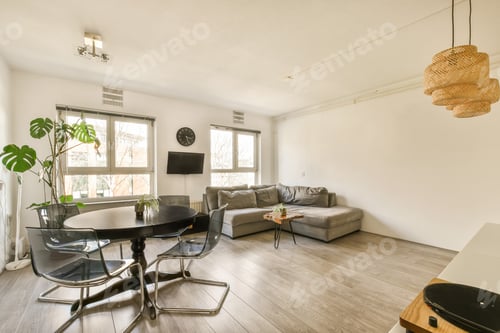 Preview: a living room with a round table and a couch