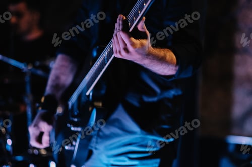 Preview: Shallow focus shot of the guitarist at the concert