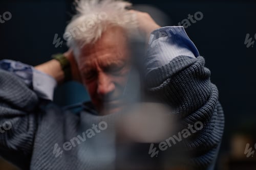 Preview: Elderly Man Having Frustration While Holding Head
