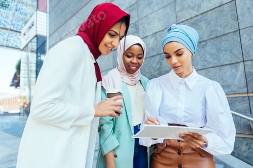 Preview: Beautiful muslim girl wearing hijab bonding outdoors