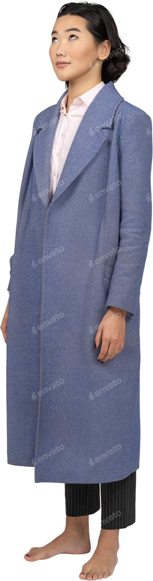 Preview: a woman wearing a blue coat and a dress and heels