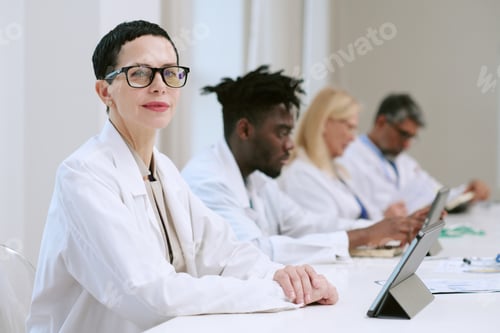 Preview: Middle Aged Woman Scientist Attending Medical Conference Meeting