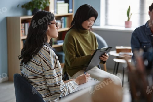 Preview: Multiethnic Teenagers Participating in Counseling Session and Taking Notes