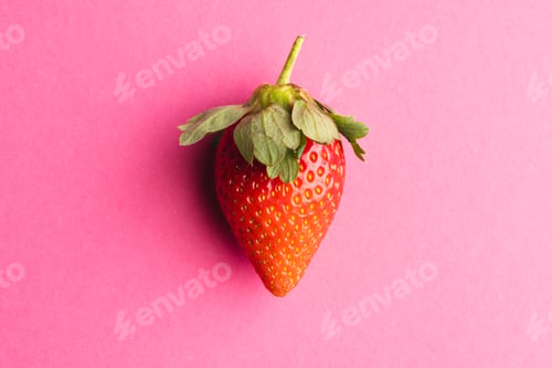 Preview: Close up of strawberry and copy space on pink background