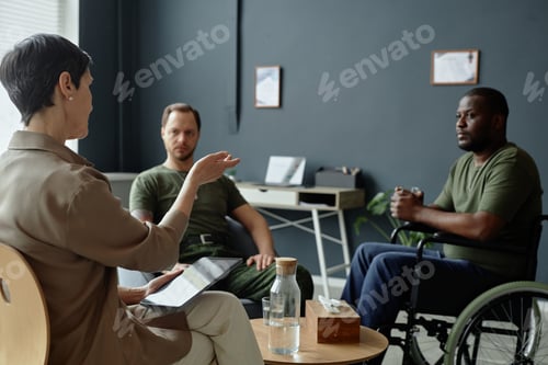 Preview: Mature Therapist Consulting Two Soldiers