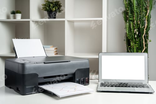 Preview: New modern printer and laptop in the office on table