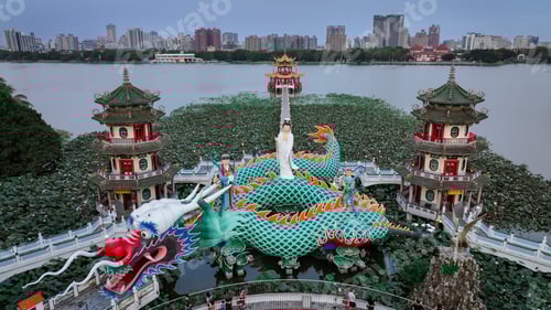 Preview: Colorful dragon boats and lotus flowers at Love River, Kaohsiung, at twilight