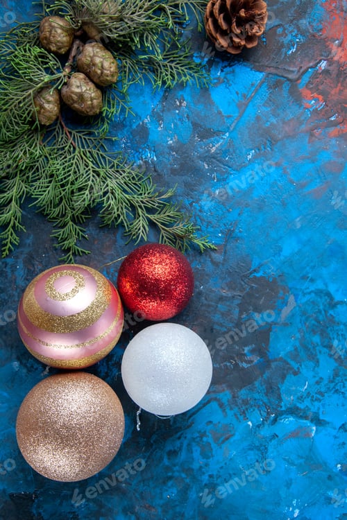 Preview: top view fir tree branches fir tree branches cones xmas tree toys on blue background free place