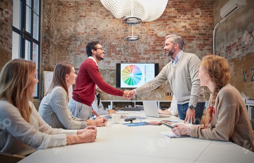 Preview: Colleagues greeting at a presentation in the office
