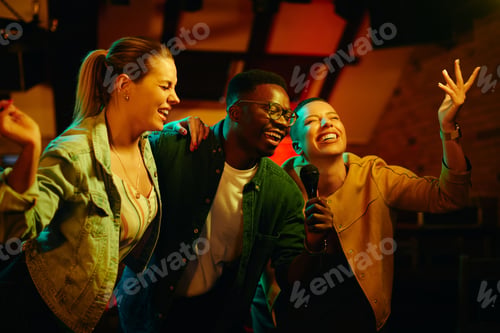 Preview: Black man and his female friends singing karaoke and having fun during their night out in a bar.