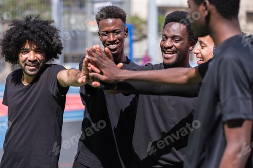 Preview: Group of young friends enjoying free time in the park