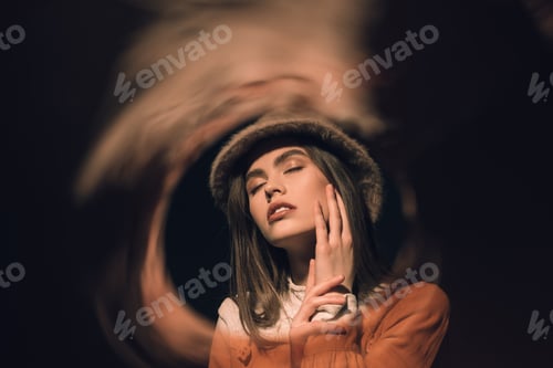 Preview: portrait of fashionable woman in hat with eyes closed