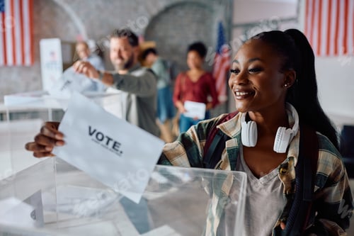 Preview: Happy black female citizen voting during United States of America elections.