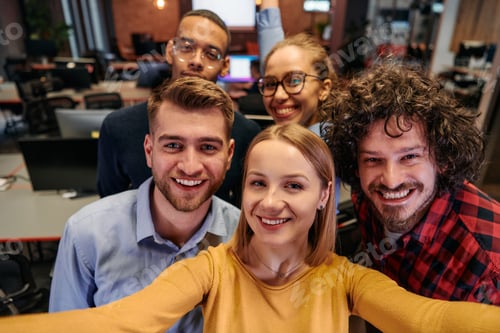 Preview: A diverse group of business professionals take a break from their tasks in a modern startup office
