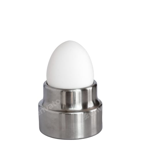 Preview: White whole breakfst egg in stainless steel egg holder isolated cutout