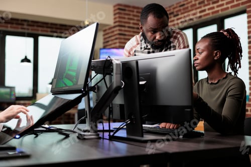Preview: Creative african american office workers discussing about 3D project development progress.