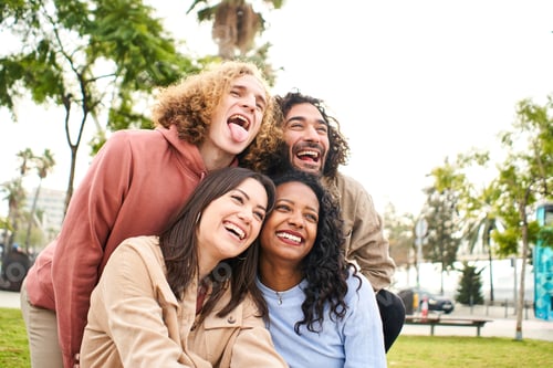 Preview: Happy friends from diverse cultures and races taking photo making funny faces