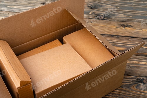 Preview: Pile of cardboard boxes on wooden background