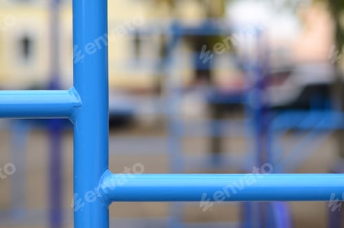 Preview: Blue metal pipes and cross-bars against a street sports field for training in athletics. Outdoor