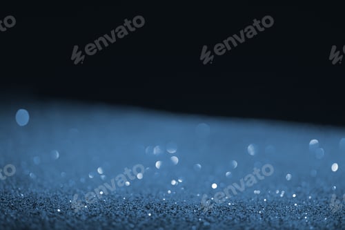 Preview: black background with blue glitter and bokeh