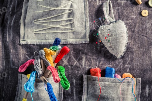 Preview: Handmade sewing cloth with scissors, needles and threads in tailor workshop