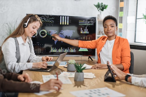 Preview: African american woman presenting financial report of worldwide economy on big monitor