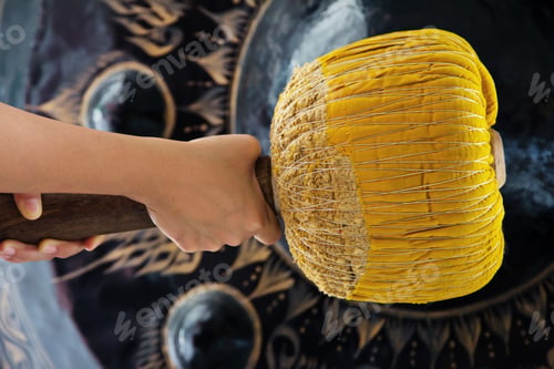 Preview: Hand hit big gong in temple