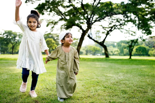 Preview: Muslim brother and sister playing in the park