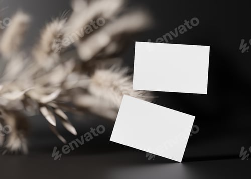 Preview: Blank white business cards on black background with dried plants. Mock up for branding identity.