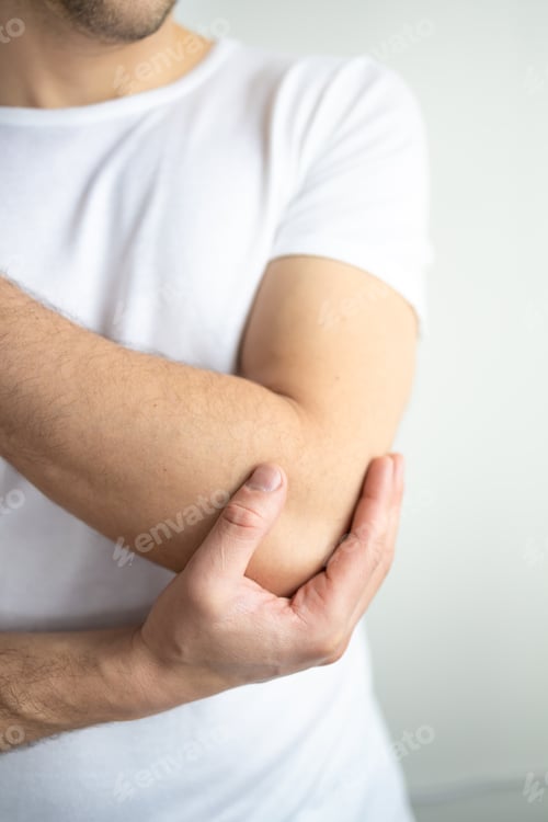 Preview: Man holding hands. Elbow pain. focus is highlighted in red. Close. Isolated background.