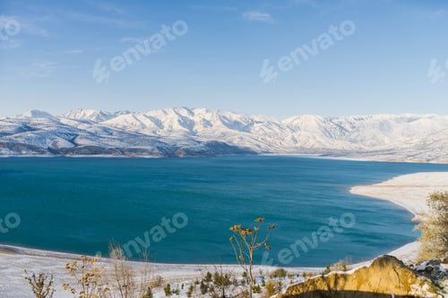 Preview: Amazing beautiful Winter Landscape of Charvak Reservoir in Uzbekistan in Winter with Blue Water
