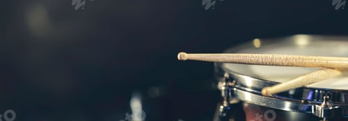 Preview: Snare drum on a dark background isolated with space for a text.