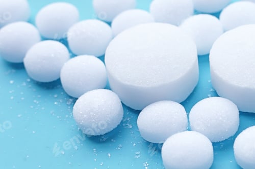 Preview: White mothballs on blue background.