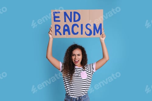 Preview: Emotional African American woman holding sign with phrase End Racism on light blue background