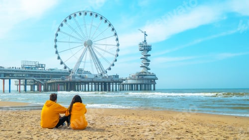 Preview: couple on the beach of Scheveningen Netherlands during Spring