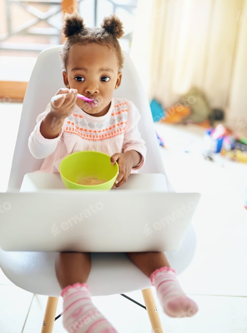 Preview: Time for breakfast. Cropped shot of an adorable little girl eating breakfast at home.