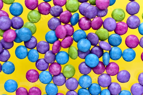 Preview: Colorful candy on a yellow background